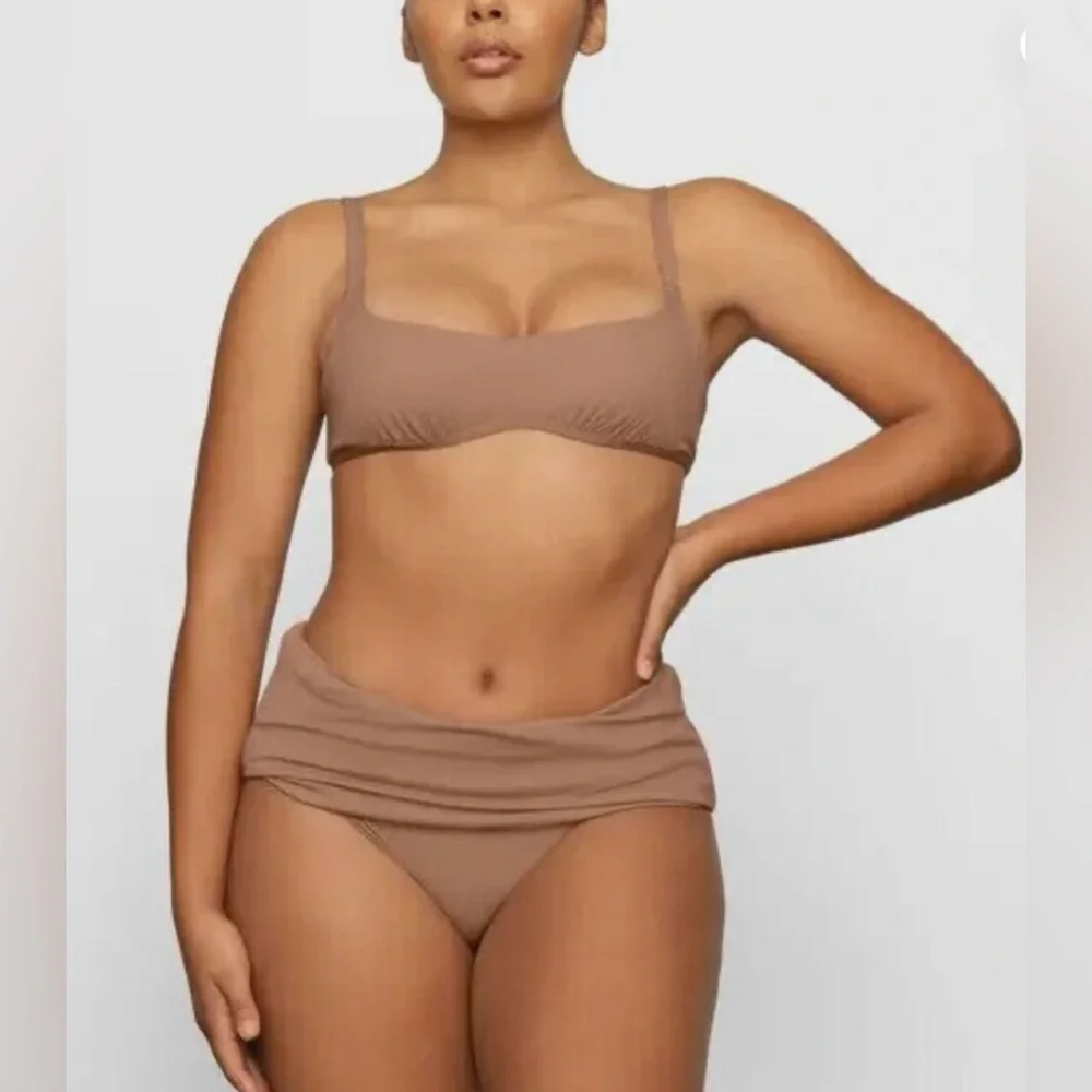 *7.  Skims Sculpting Ruched Swim Top